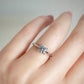 Solitaire diamond ring with claddagh setting on models hand