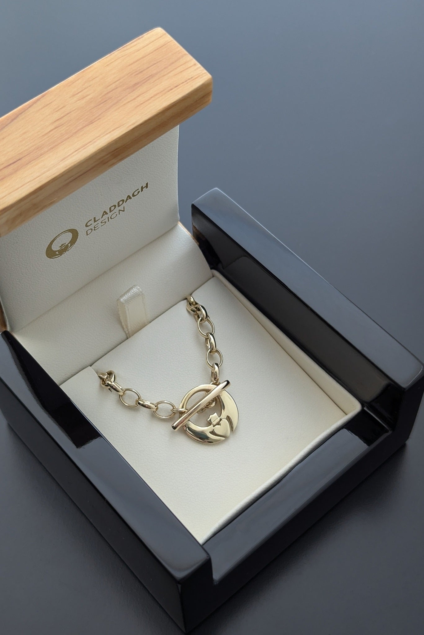 gold claddagh bracelet in box