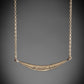 gold curved gra necklace