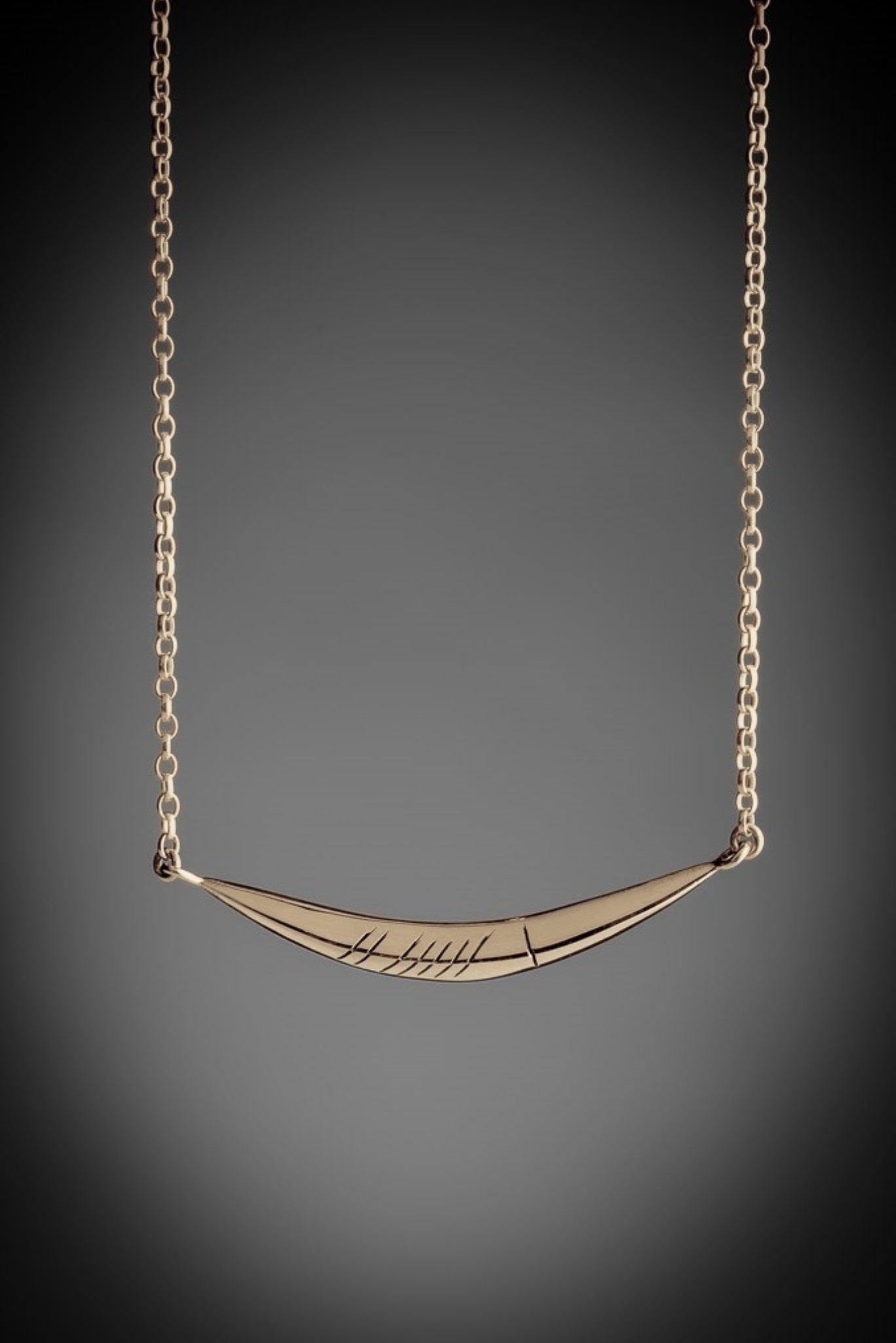 gold curved gra necklace